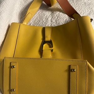 Brand new Yellow never used Dooney and Bourke over the shoulder bag